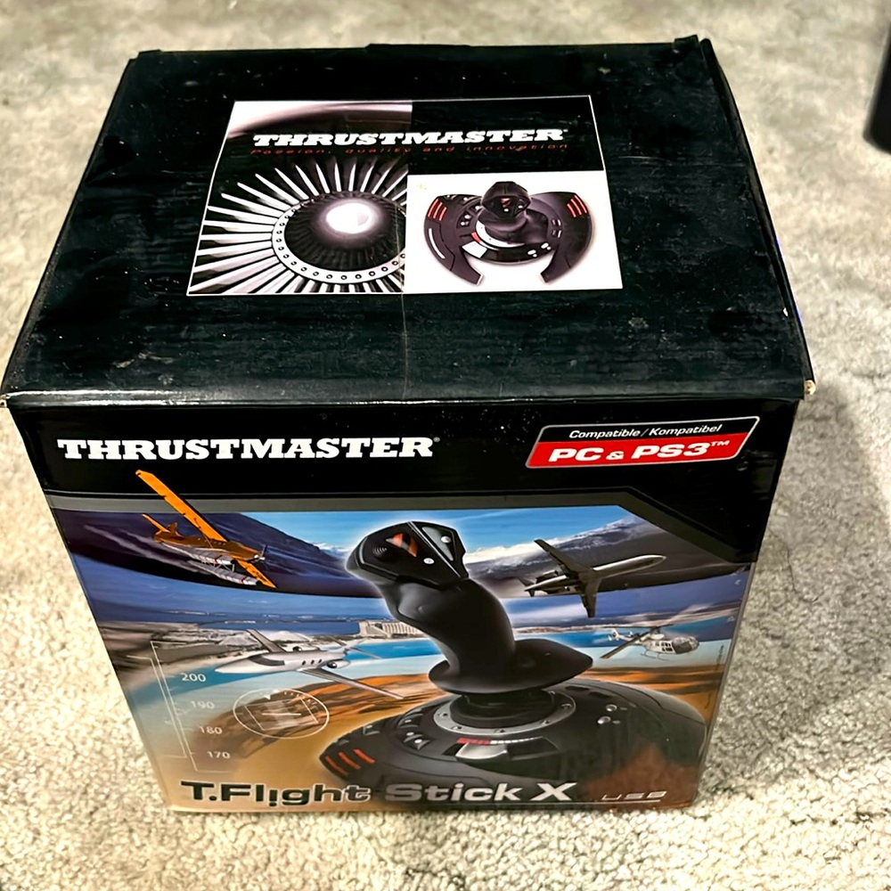 This is a T Flight Stick X. It comes in its original box with 2 additional discs